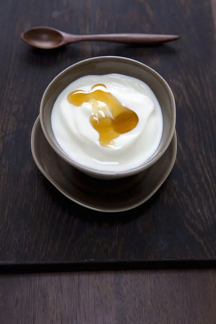 People often recommend drinking warm milk to get back to sleep, because of the way calcium helps people process tryptophan and melatonin in the body. But any dairy product contains calcium, and the American Sleep Association recommends both yogurt and honey (which contains calming glucose) as foods to cure insomnia. 