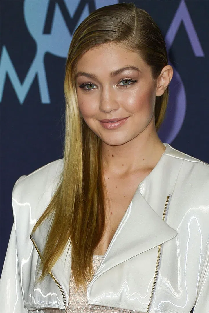 Gigi Hadid opts for sleek and straight hair.