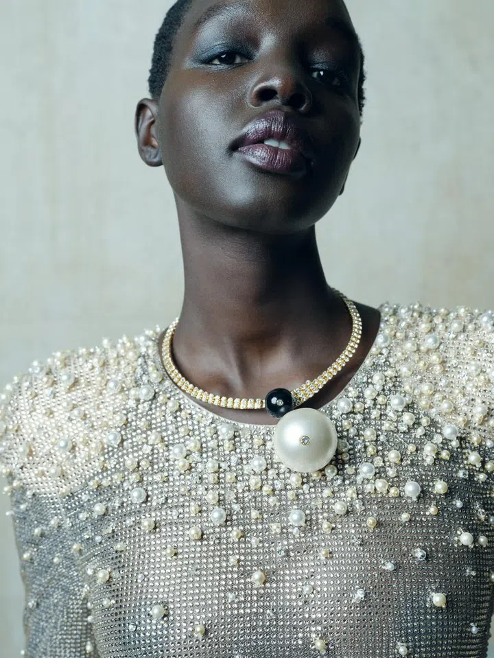 Model wears Armani Privè beaded mesh gown.