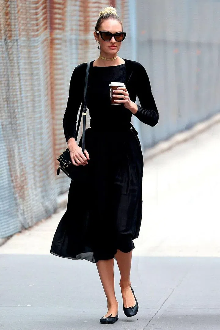 When you think of spring, the image of pastels and florals might immediately come to mind, but Candice Swanepoel proves that a classic black midi dress can have even more  of an impact. Simply team with ballet pumps and a statement pair of shades. Photo: Getty 