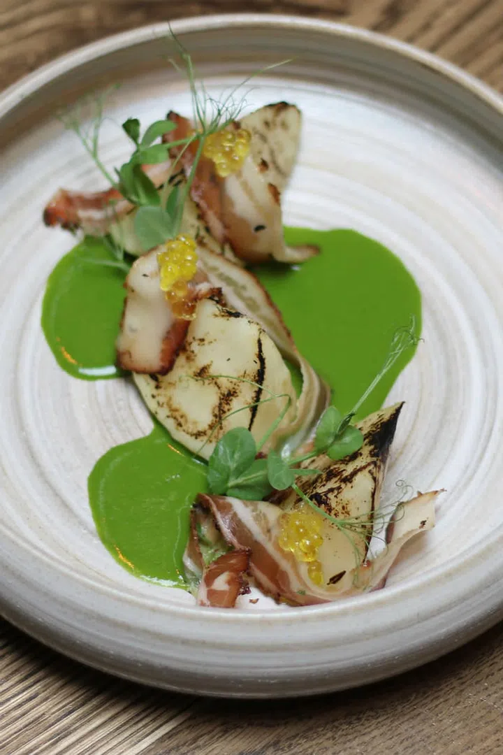 A fresh, earthy sweet celeriac from Genting,
salt-baked in a salt crust. Lightly grilled and
slow-cooked in a puree of wild watercress, olive
oil and dutch radish, balanced with the savoury
flavours of swiss cured ham “Speck” and smoky bacon.

Photo: Courtesy of Open Door Policy