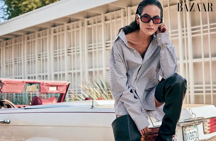 Shirt; boots, Bottega Veneta. Sunglasses, Jacques Marie Mage. Rose gold and diamond Juste un Clou earrings; steel Panthère de Cartier (small) watch; rose gold Écrou de Cartier rings, Cartier. Earrings (top), model’s own