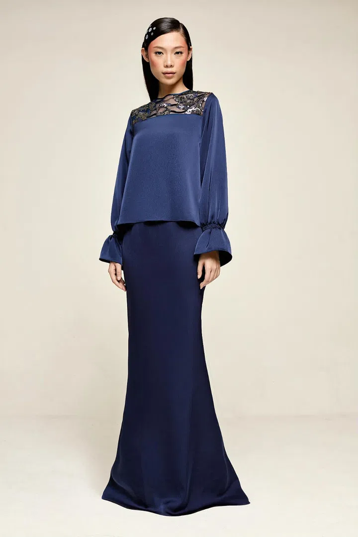 The bell sleeves add a sense of glamour, while the lace panel adds a dash of feminine charm to this versatile piece. Photo: Society A