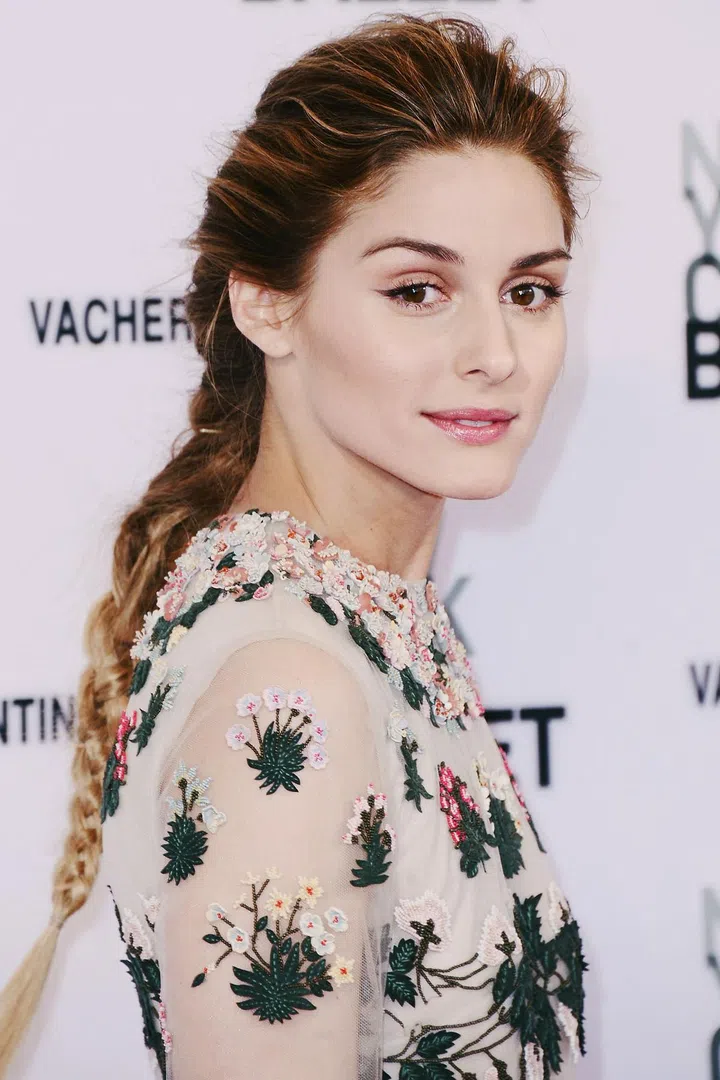 Palermo's French braid adds easy elegance to her intricate gown—a few pulled-out strands at the crown keep it from looking too perfect.