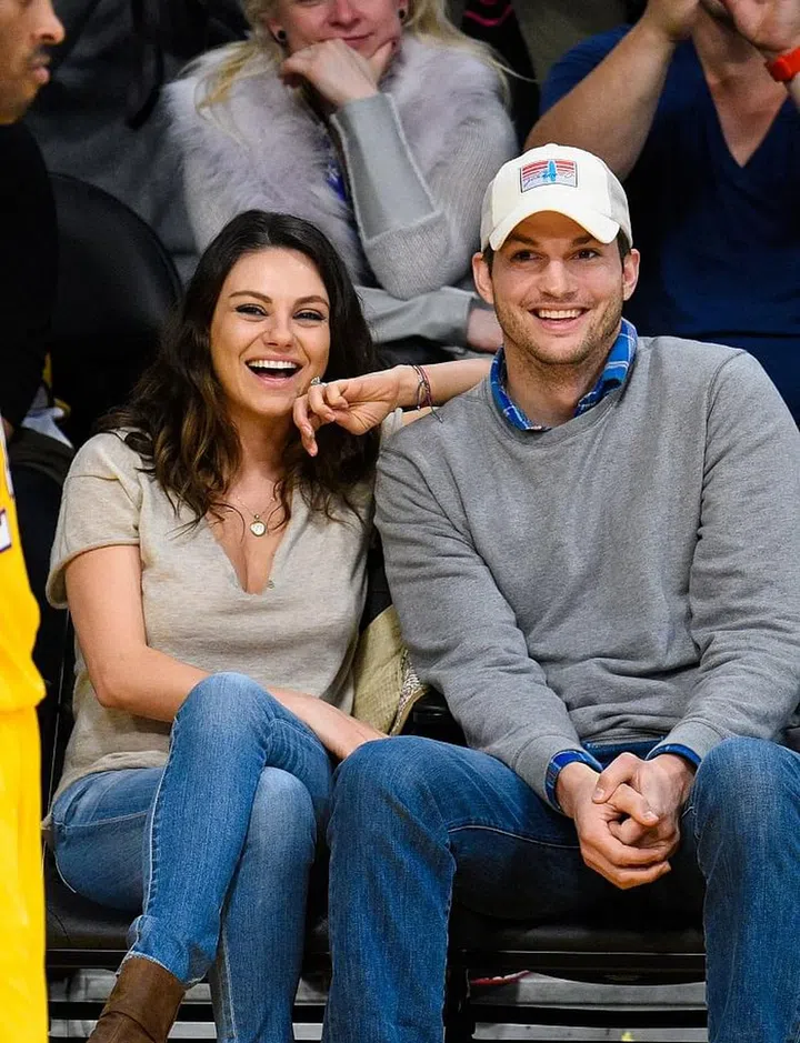 LOS ANGELES, CA - DECEMBER 19:  Mila Kunis (L) and Ashton Kutcher attend a basketball game between the Oklahoma City Thunder and the Los Angeles Lakers at Staples Center on December 19, 2014 in Los Angeles, California.  (Photo by Noel Vasquez/GC Images)