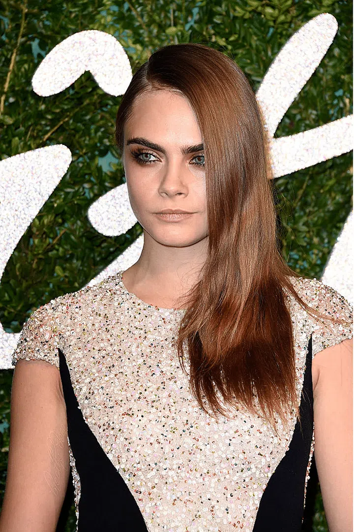 Switching black for brown shadow to match her glossy brunette tresses.