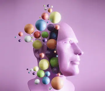 Flying spheres from sliced head, neurodiversity concept