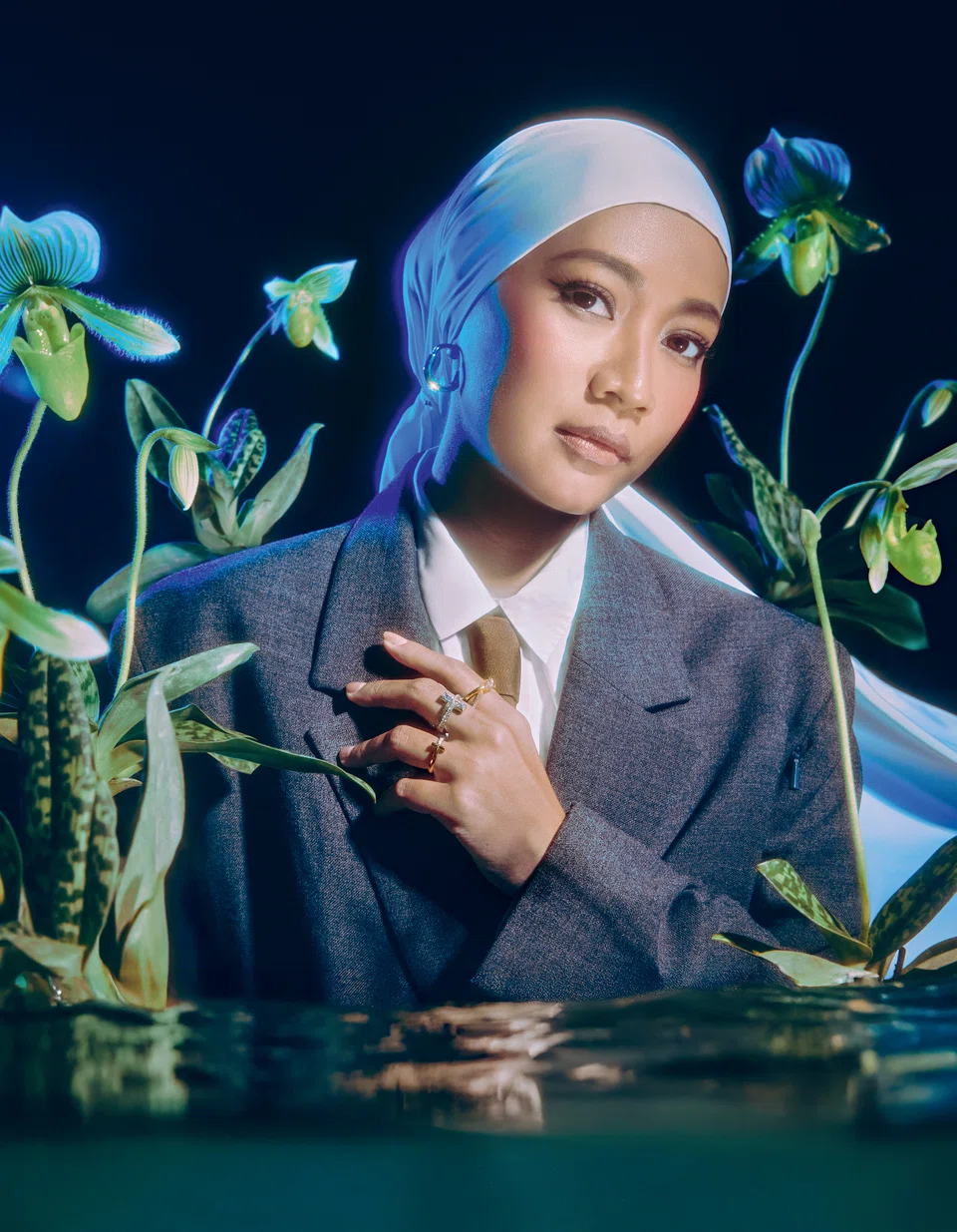 Tiffany Lock yellow gold medium earrings with diamonds, Tiffany T T1 rose gold ring diamonds, Tiffany T T1 white gold ring with baguette and pave diamonds, and Tiffany Knot Double Row yellow gold ring with diamonds. Chiffon scarf, Adlina Anis. Blazer, shirt and tie, stylist’s own 