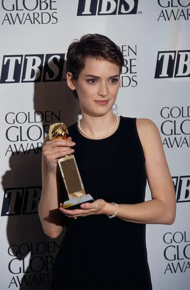 Winona Ryder holds her Golden Globe Award after the 1994 ceremonies in Beverly Hills, California. Ryder won the Golden Globe for Best Supporting Actress in the 1993 film The Age of Innocence, directed by Martin Scorsese. (Photo by �� Steve Starr/CORBIS/Corbis via Getty Images)