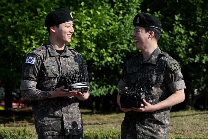 YEONCHEON-GUN, SOUTH KOREA - JUNE 11: K-pop band BTS's members Jungkook (L) and Jimin (R) are discharged from a mandatory military service on June 11, 2025 in Yeoncheon-gun, South Korea. Four members of the K-pop group BTS's RM, V, Jimin and Jungkook will be discharged from their mandatory 18-month military service next week, the boy band's agency said. RM, the leader of the group, and V completed the 18-month mandatory military service, which is required for all able-bodied male citizens in South Korea before they turn 28, followed by Jimin and Jungkook the next day, according to BigHit Music. (Photo by Han Myung-Gu/Getty Images)