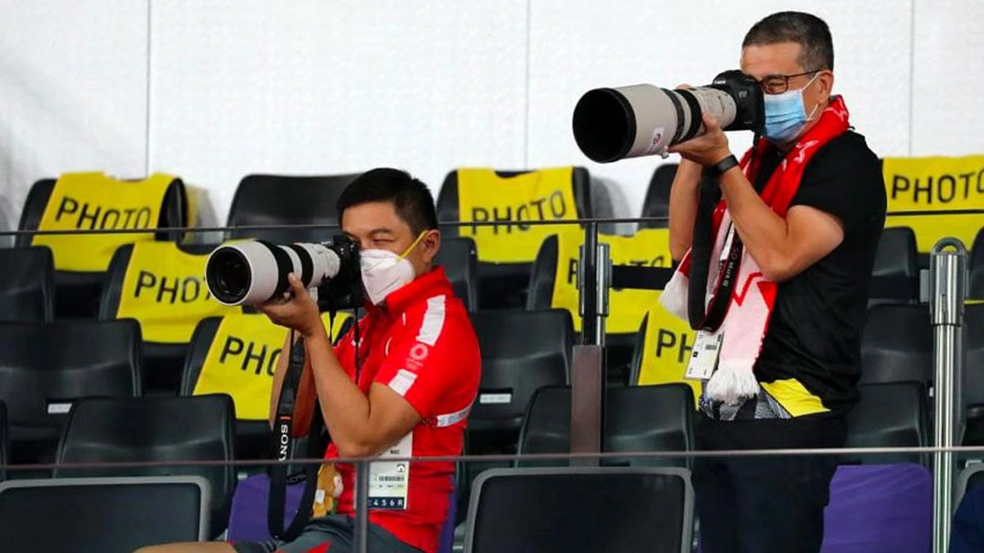 Mr Tan Chuan-Jin (left) and Mr Edwin Tong have coupled their ardent support for Team Singapore with their passion for photography.