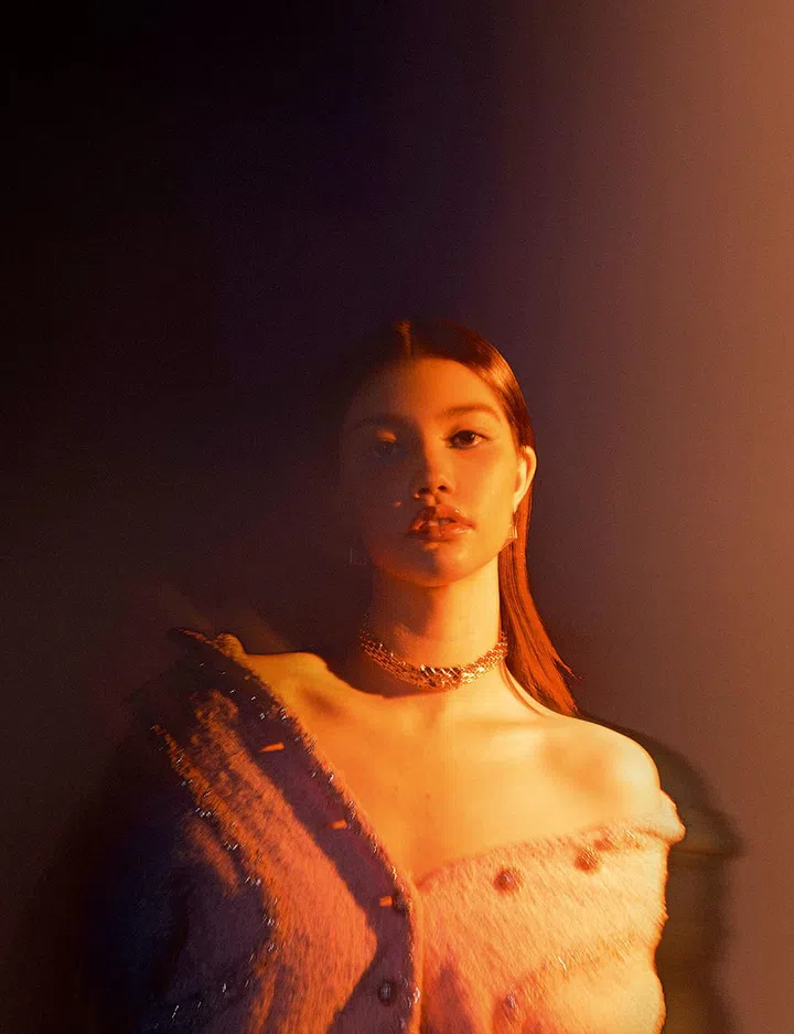 Tweed jacket with embellished details and buttons, gold tone choker, and hoop bag earrings, Chanel