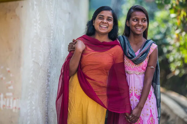 Village: BERHABAD,  Block: JAMUA,  District: GIRIDIH, State: JHARKHAND Country: India,  22nd DECEMBER 2016 . 
17 years old Mamta and 16 years old Vinita stand outside their home  in  the village of Berhabad, in Jamua block of Giridih. Mamta is one of the benificiery of the Karate programme taught under this programme to empower girls with self defence and confidence leading them to be their own decision makers.  " Earlier we had to form groups and go to school, and return as boys and men would trouble us on the way." Says 17 years old Mamta. 
Giridih district has one of the highest rates of child marriage in India where 6 out of 10 girls are married before 18 years. UNICEF Jharkhand in partnership with the Jago Foundation has launched a pilot programme to make 65 villages Ôchild marriage freeÕ in the district.
The programme trains over 500 adolescent girls in the pilot villages. Around 70 adolescent boys and girls groups have been formed under the project. It includes empowerment of adolescents through formation of groups, engagement with religious and caste leaders, awareness generation in villages through folk media and street theatre, formation of village child protection committees, pledge by parents in villages, orientation of stakeholders like block development officers, anganwadi wokers, ASHA, school teachers, etc.
 
 UNICEF India/2017/Prashanth Vishwanathan

Prashanth Vishwanathan's coverage in Jharkhand district -
Giridih , Block - Jamua  against Child Marriage .  UNICEF Jharkhand in partnership with the Jago Foundation has launched a pilot programme to make 65 villages ‘child marriage free’ in the district.