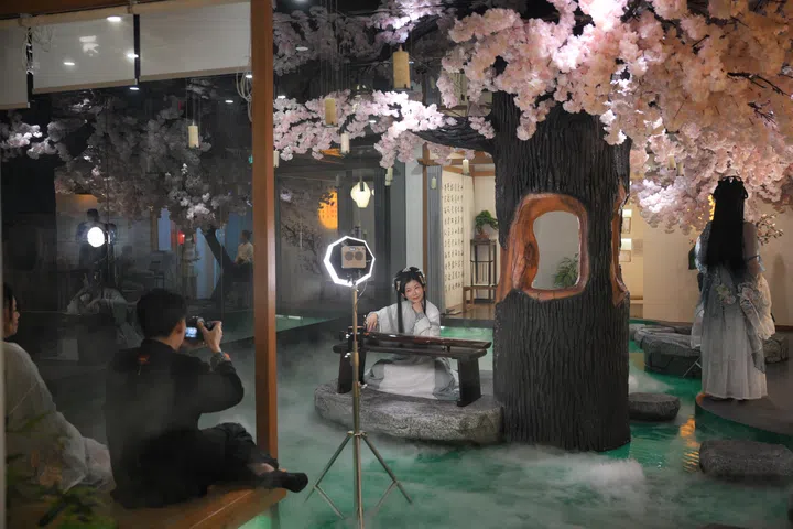 Patrons dresses up in Hanfu, a traditional Chinese dress, during a photo shoot at Yagyo Haven, a chinese spa that opened in January, on March 6, 2026.