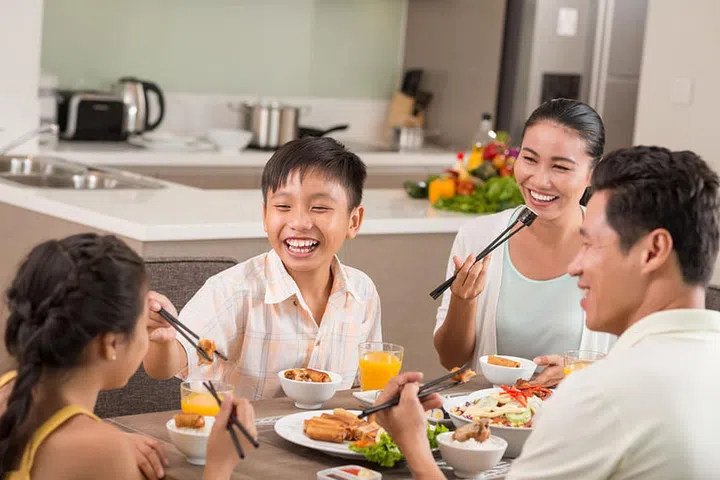 Asian people having fun at the family dinner