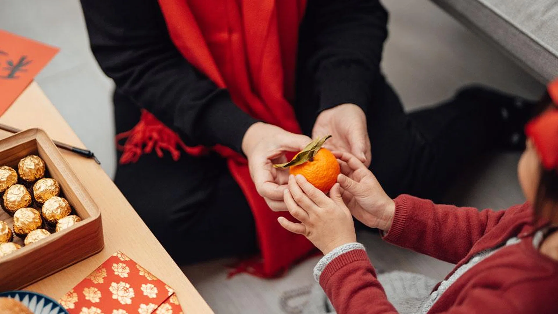 exchanging oranges lunar new year celebration