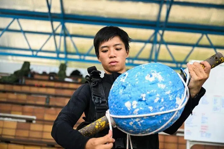 Cpt Tan inspecting diving equipment before a live diving session at Sembawang Camp on April 8. ST PHOTO: AZMI ATHNI