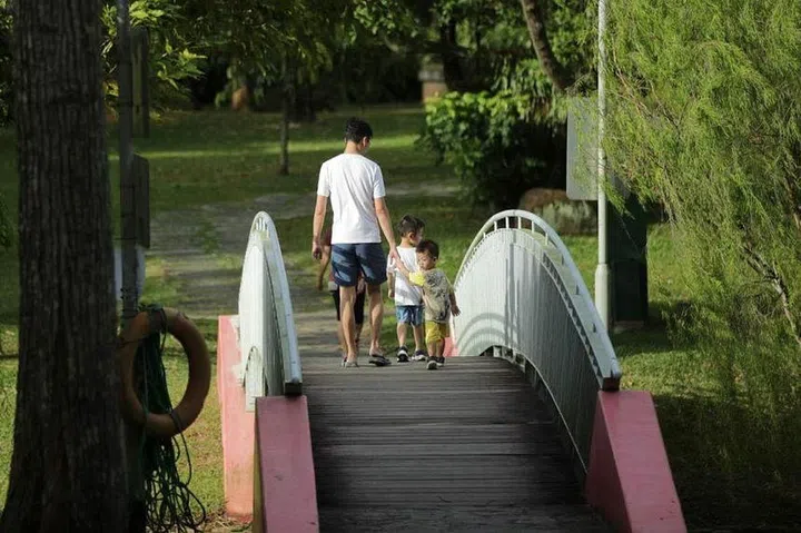 Government-paid paternity leave will be doubled to four weeks. Unpaid infant care leave for parents will also be doubled to 12 days. ST PHOTO: GIN TAY
