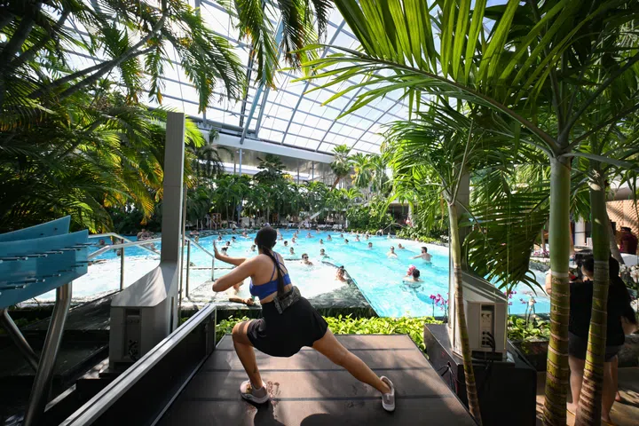 [Embargoed till June 19, 2026]

ST20260510-202624300559-Lim Yaohui-Christine Tan-chthermexx/

Visitors exercising inside the main pool at The Palm in Therme Bucharest in Romania on May 11, 2026. 

It is the largest relaxation, wellness and entertainment centre in Europe based on thermal waters. Located just 10 minutes from Bucharest, it has become one of Romania’s most popular attractions since opening in 2016, welcoming more than 8 million visitors to date.

Therme Singapore will be Therme Group’s first project in Southeast Asia and Asia’s first large-scale wellbeing destination of its kind. Located on a four-hectare waterfront site adjacent to Gardens by the Bay and Marina Barrage, the development is expected to become a major addition to Singapore’s Marina Bay precinct and wider tourism landscape.

In November 2025, Therme Group was awarded the tender by the Singapore Tourism Board to develop the site. The project is expected to involve an investment of approximately S$1 billion and is projected to welcome around two million visitors annually when it reaches full operational capacity, and is slated to open in 2030.

(ST PHOTO: LIM YAOHUI)