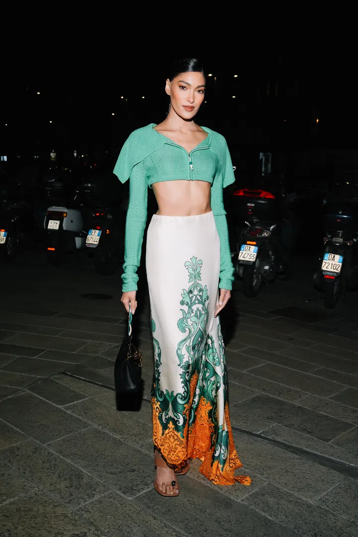 MILAN, ITALY - FEBRUARY 27: Pritika Swarup is seen wearing a cropped green sweater, maxi skirt, a black handbag outside the Etro show during the Milan Fashion Week Womenswear Fall/Winter 2025/2026 on February 27, 2025 in Milan, Italy. (Photo by Alena Zakirova/Getty Images)