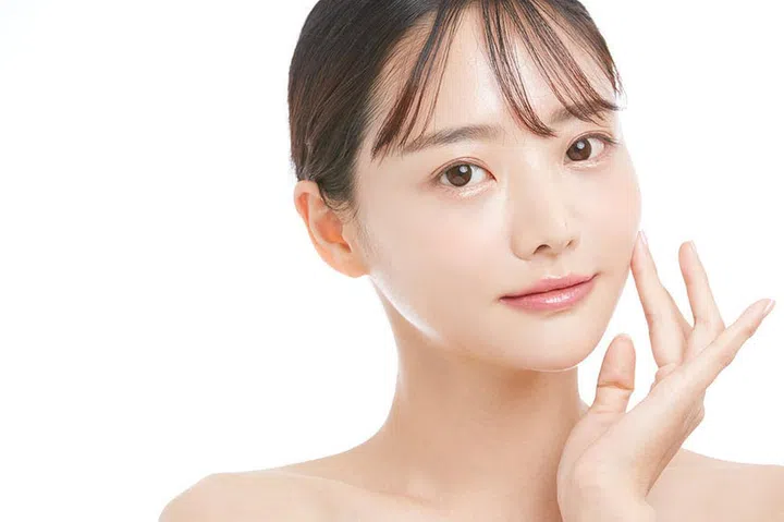 Beauty portrait of a young Asian woman with a white background