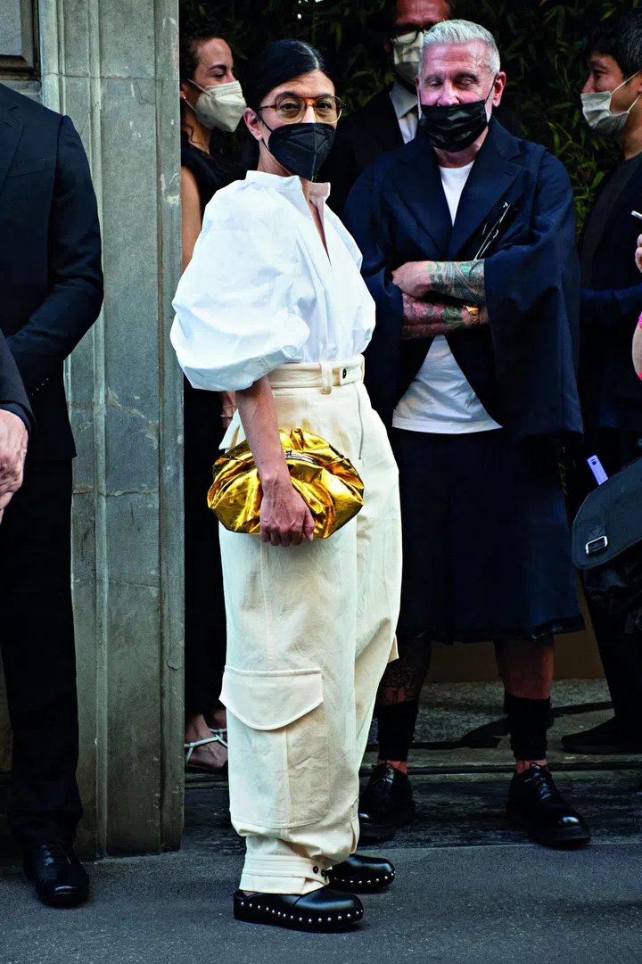 A fashion person in a Street Style photo out of Giorgio Armani fashion show Spring Summer 2022 men ready to wear fashion show on June 2021 in Milan, Italy