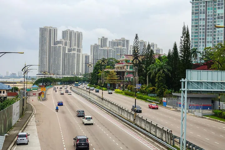 JOHOR BAHRU,MALAYSIA, 8 MARCH 2018: Traffic flow on a highway during offpeak hour at sunny hot day.