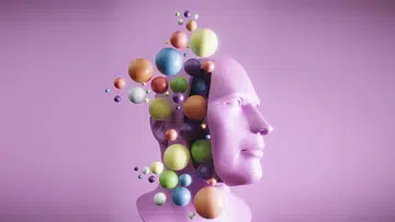 Flying spheres from sliced head, neurodiversity concept