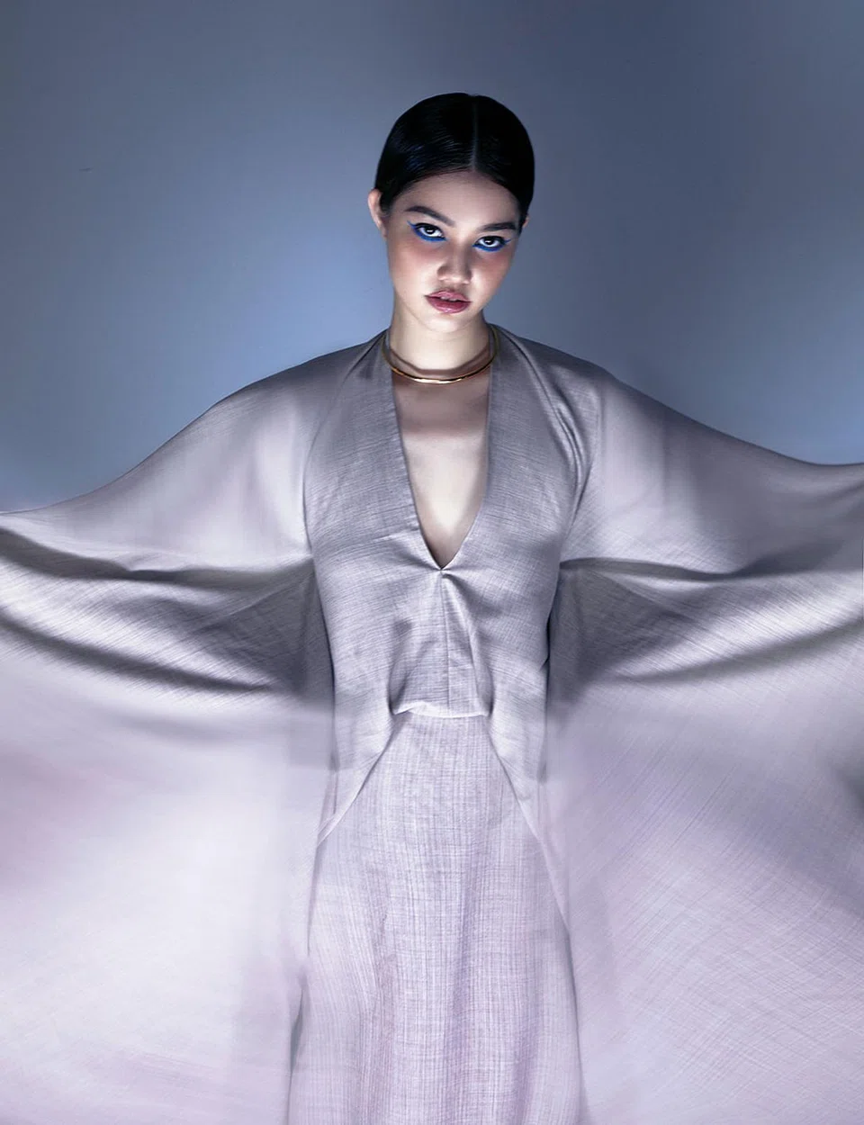 Flannel dress, Fendi. Gold choker, Pomellato