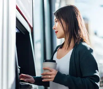 woman withdrawing money bank | Year of the Fire Horse: Youre 2026 wealth forecast 