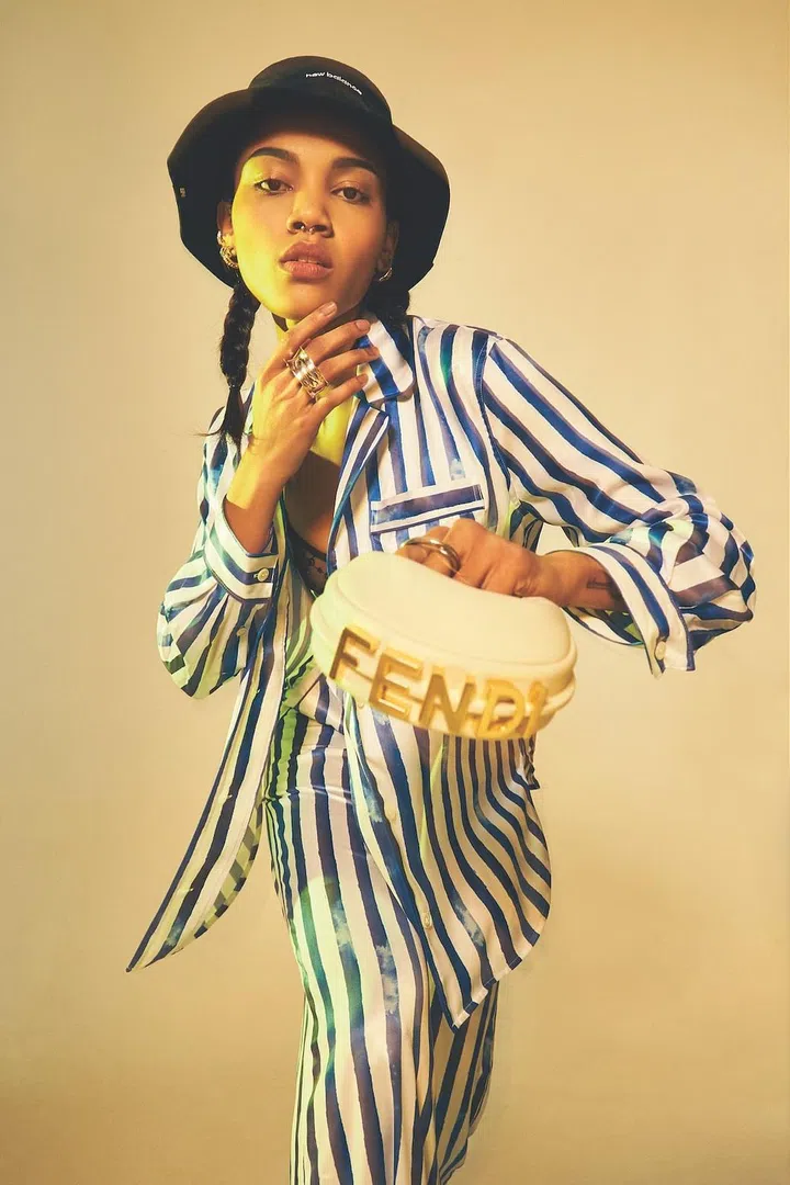 Long-sleeved shirt and matching flared pants, Polo Ralph Lauren. Mesh bralet and high-waisted underwear, Gucci. Skinny leather belt and calfskin mini hobo bag, Fendi. Reponse silver double ring, Hermes. Cotton bucket hat, New Balance