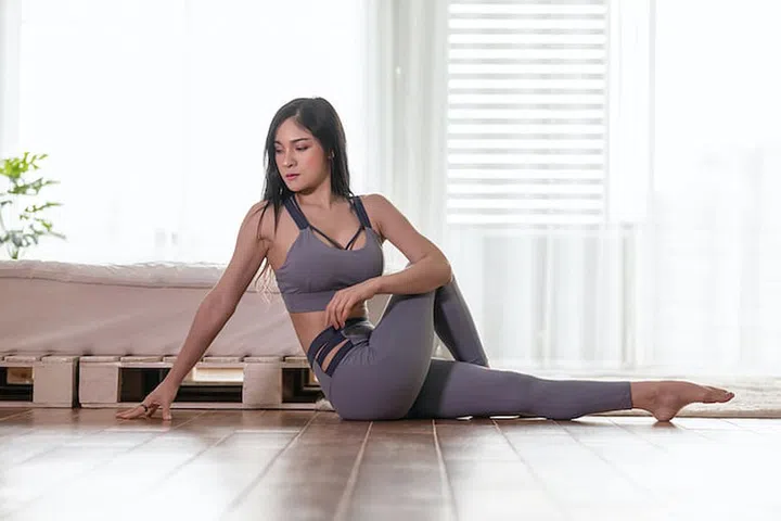 Attractive Asian woman practice yoga Seated Twist pose to meditation in bedroom after wake up in the morning Feeling so comfortable and relax,Healthcare Concept