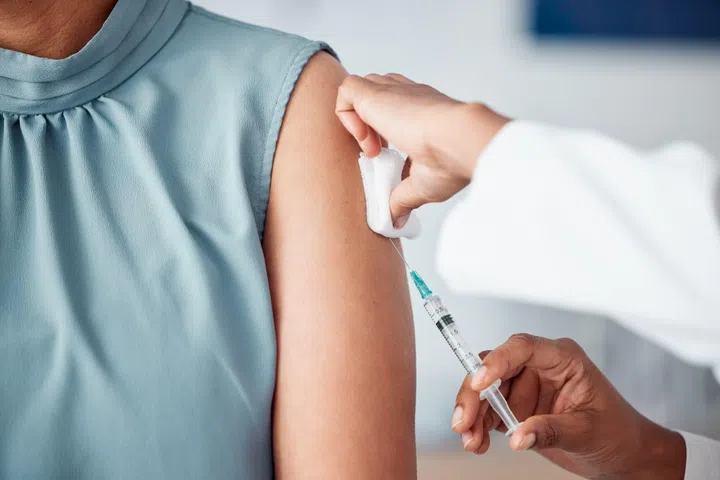 0312 Darwis [秀慧]
Hands, medical and doctor with patient for vaccine in a clinic for healthcare treatment for prevention. Closeup of a nurse doing a vaccination injection with a needle syringe in a medicare hospital.