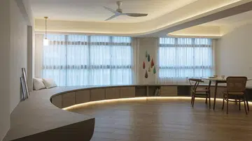 A whimsical home for gatherings with a round living room