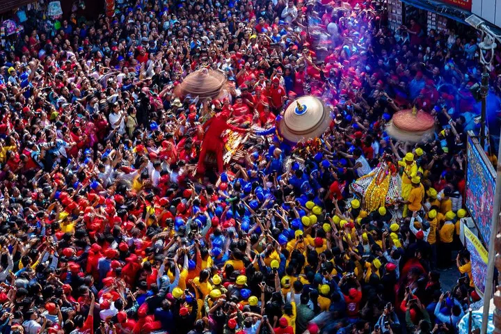 The Newa community celebrates the Pahachahre festival by pulling chariots of various goddesses at Asan Chowk in Kathmandu, Nepal, on March 19, 2026. Chariots of goddesses such as Lumadi, Bhadrakali, and Kankeshwari are pulled and brought together to meet, symbolizing the gathering of sisters at Asan Chowk. The festival features traditional music, masked dances, and ritual performances. Communities come together in celebration, strengthening social bonds and preserving their rich heritage. (Photo by Ambir Tolang/NurPhoto via Getty Images)