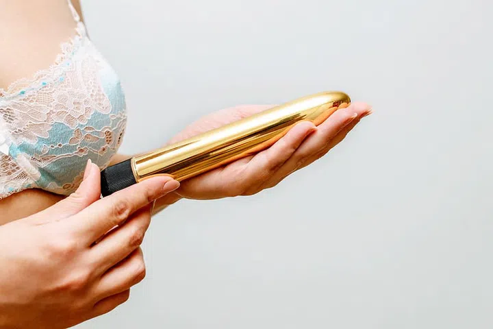 the girl's photo with the vibrator in hands