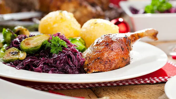 Christmas roast duck served on a festive table.