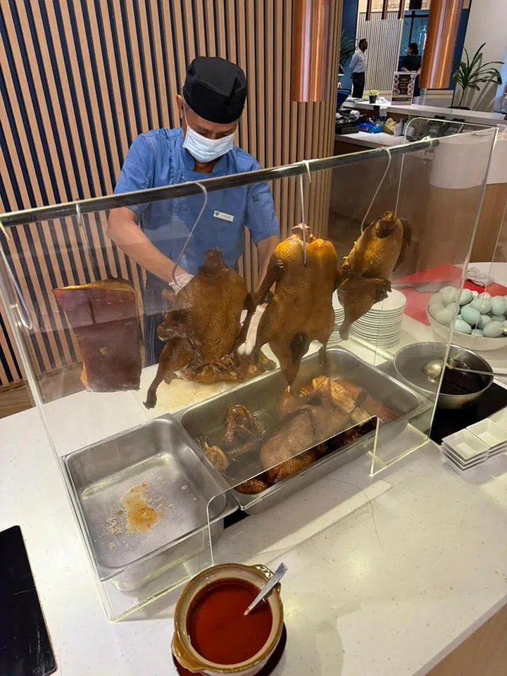 Cafe Lodge at YWCA Fort Canning has a live station for braised duck and pork belly at its Porridge Buffet.