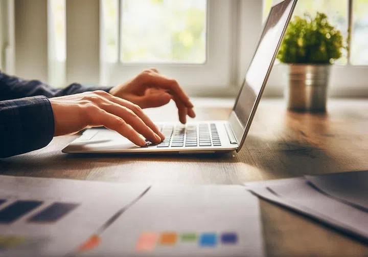 businessman using laptop computer sitting working office.