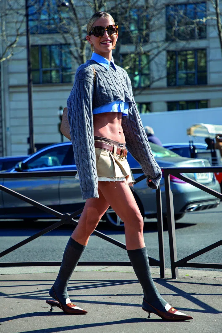 A fashionista, Caroline Daur, in a Street Style photo out of Miu Miu Fall Winter 2022 Women Ready to Wear Fashion Show on March 2022 in Paris, France at Palais d'Iéna