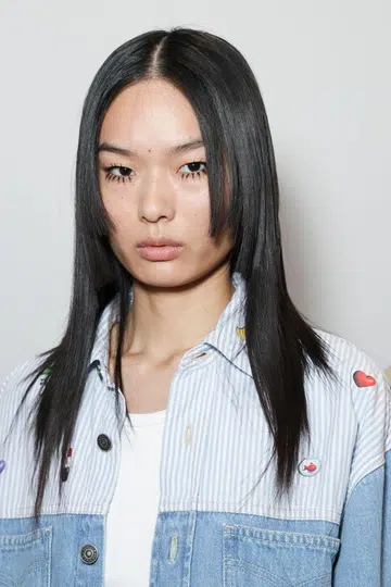 Model backstage with fake eyelashes