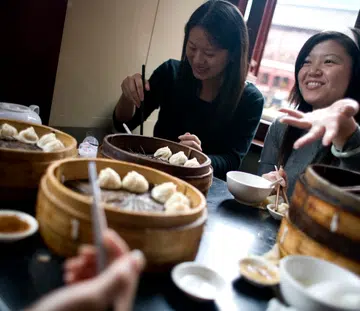 Image of women having food together