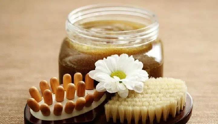 jar of body scrub and massager - beauty treatment