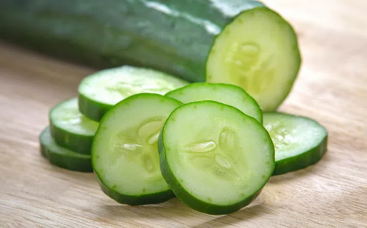 Fresh Cucumber  slices on wood background