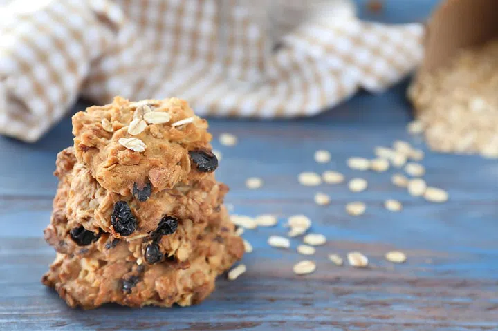 Delicious oatmeal cookies on wooden background, closeup
