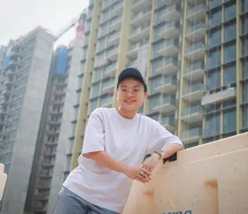 ST20260422_202641200896/jlyoung/Joyce Lim/Jason Quah

Teri Tan, 32, who bought a unit at Pinetree Hill (background), pictured April 22, 2026. ST PHOTO: JASON QUAH
