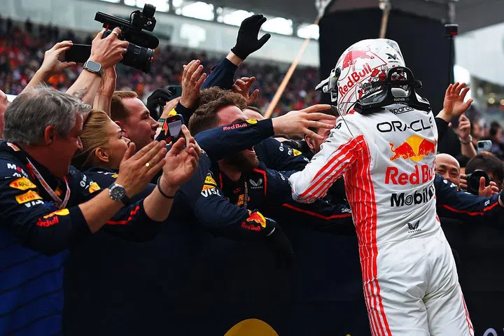 SUZUKA, JAPAN - APRIL 06: Race winner Max Verstappen of the Netherlands and Oracle Red Bull Racing celebrates with his team in parc ferme during the F1 Grand Prix of Japan at Suzuka Circuit on April 06, 2025 in Suzuka, Japan. (Photo by Bryn Lennon - Formula 1/Formula 1 via Getty Images)