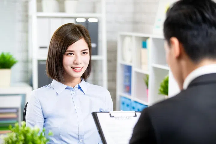 confident asian woman talk to interviewer for a job interview