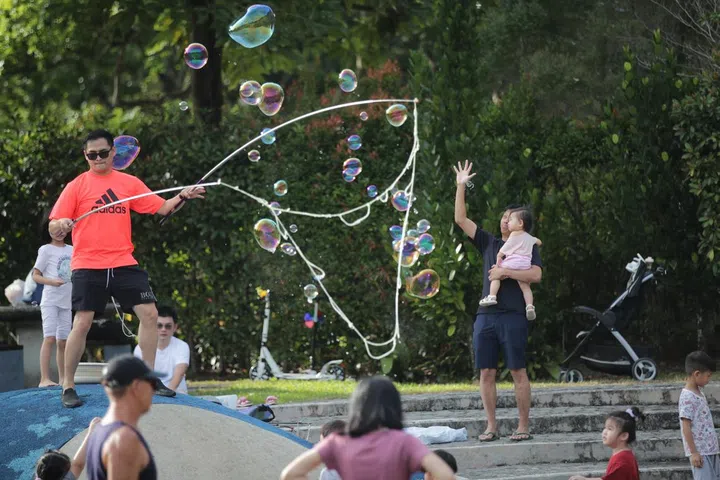 Families and children playing with bubbles at the water playground @Bishan-Ang Mo Kio Park, 26 February 2023. Can use for stories on park, greenery, destress, family, outdoor activities, kids, exercises, water playground, 
