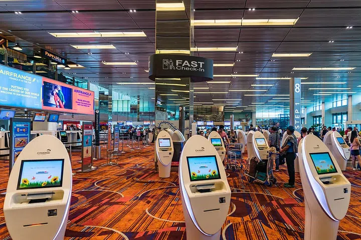 Singapore - September 24, 2017: Visitors walk around Departure Hall in Changi Airport. It has 3 passenger terminals, and is one of the largest transportation hubs in Asia and serves more than 100 airlines.